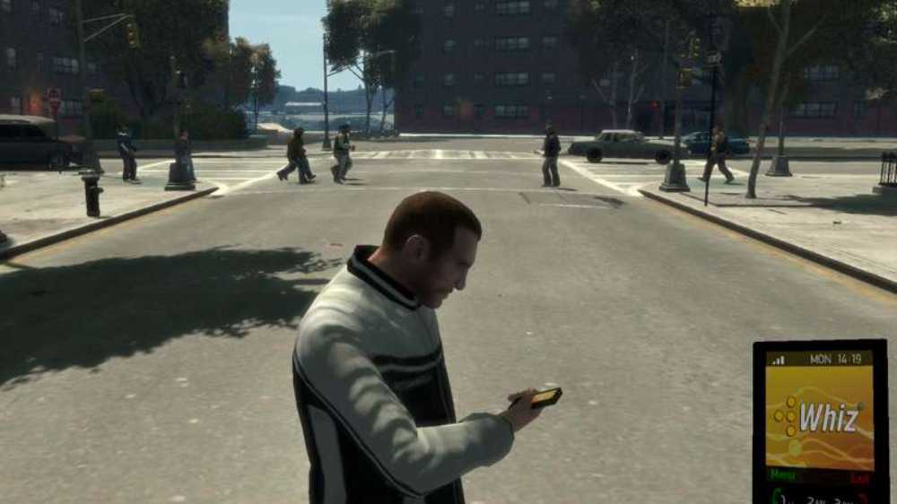 Niko Belic korzysta z telefonu